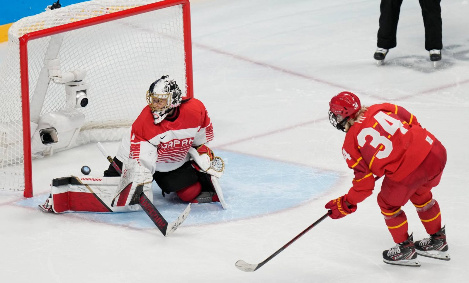 Chinese hockey team loses 1st trial game for Olympics in OT