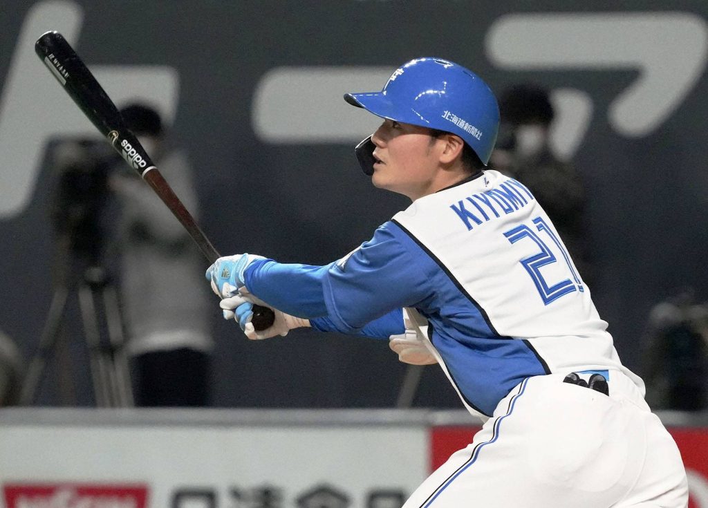 Nippon Ham Fighters No. 1 pick Kotaro Kiyomiya displays his jersey