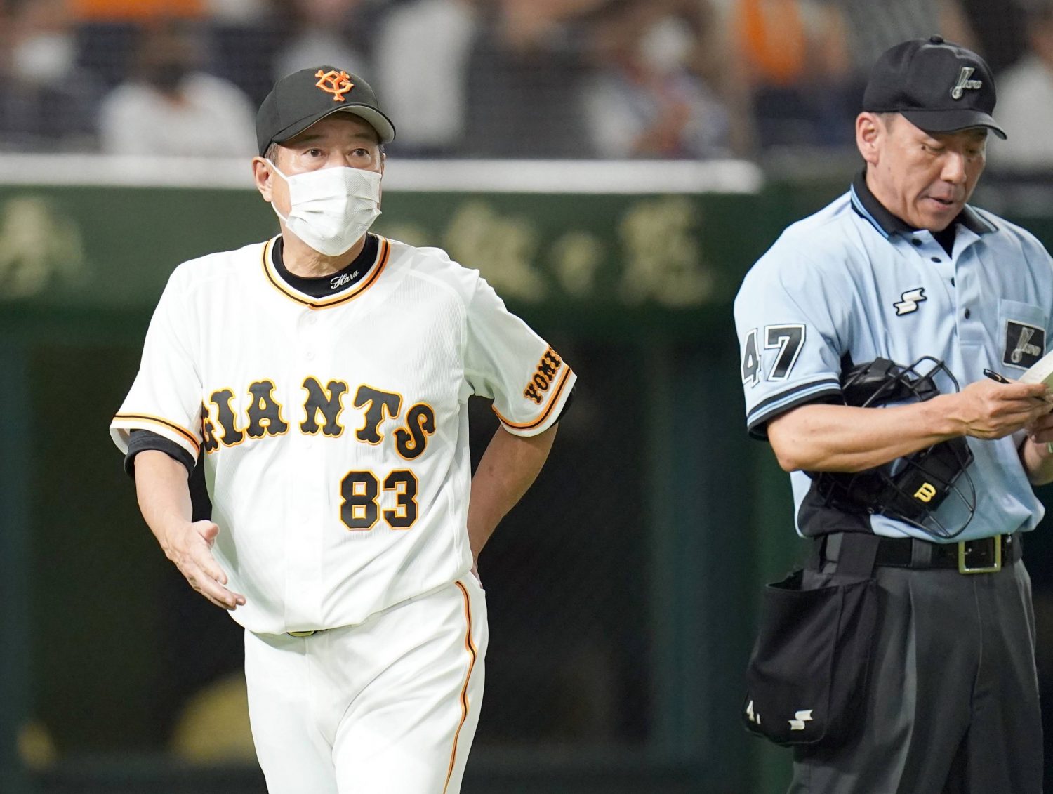 TOKYO, Japan - Yomiuri Giants manager Tatsunori Hara (2nd from L) joins  players of his team in showing off the Japanese professional baseball  club's new uniforms in Tokyo on Dec. 22, 2014