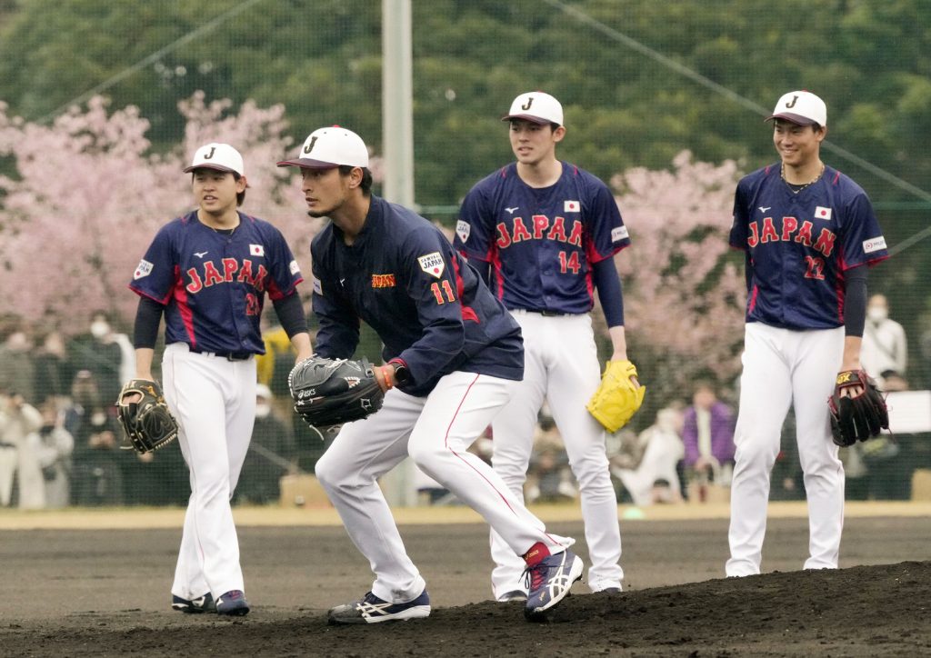 Japan pitcher Roki Sasaki takes part in team practice in Miami