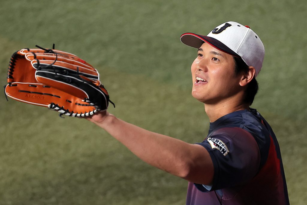 Why are the Los Angeles Dodgers wearing the caps from Nagoya's professional  baseball team?