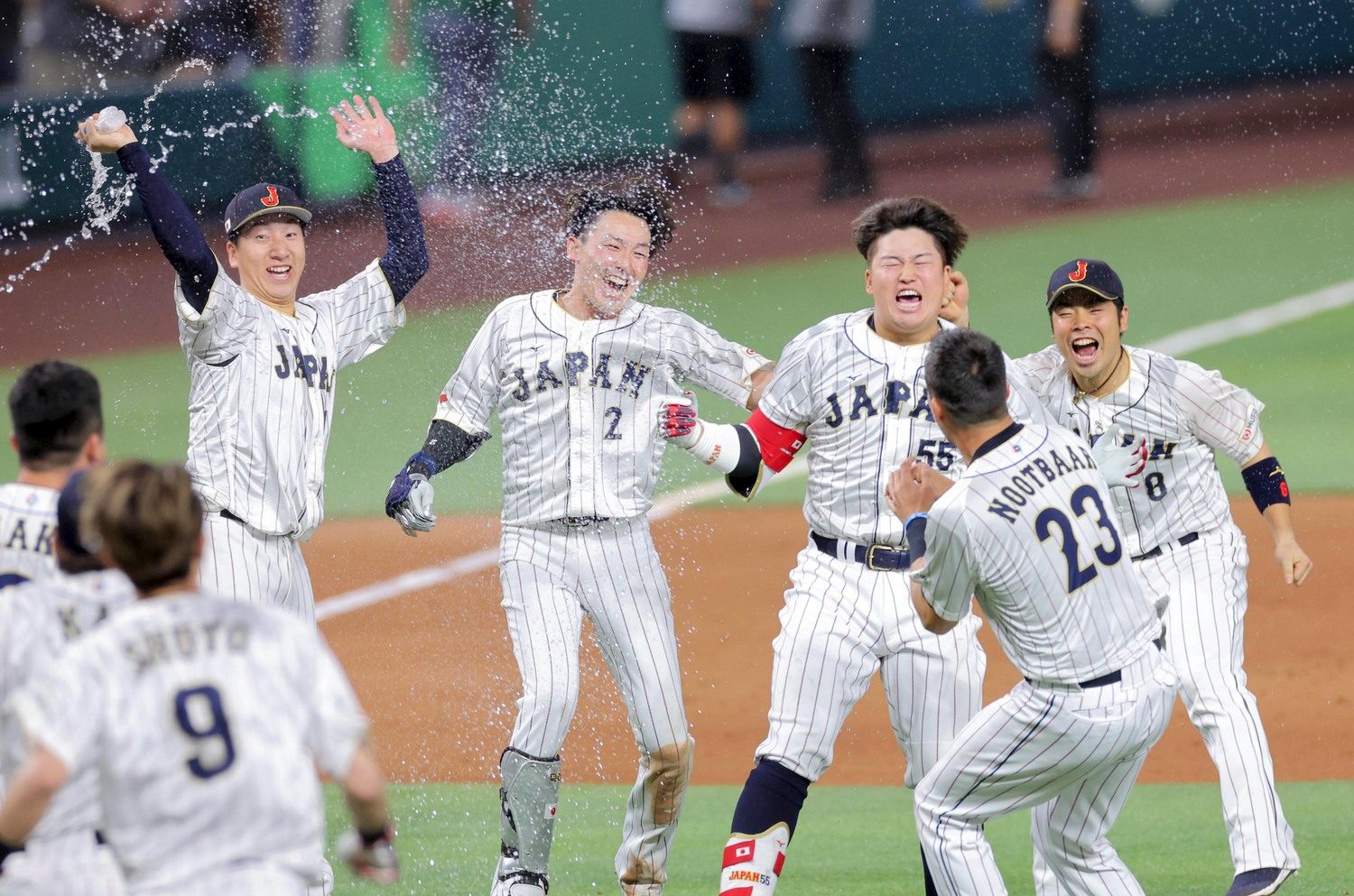 Munetaka Murakami of Team Japan reacts to hitting a walk off two